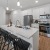 a kitchen with white cabinets