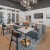 a living room with a large dining table and chairs