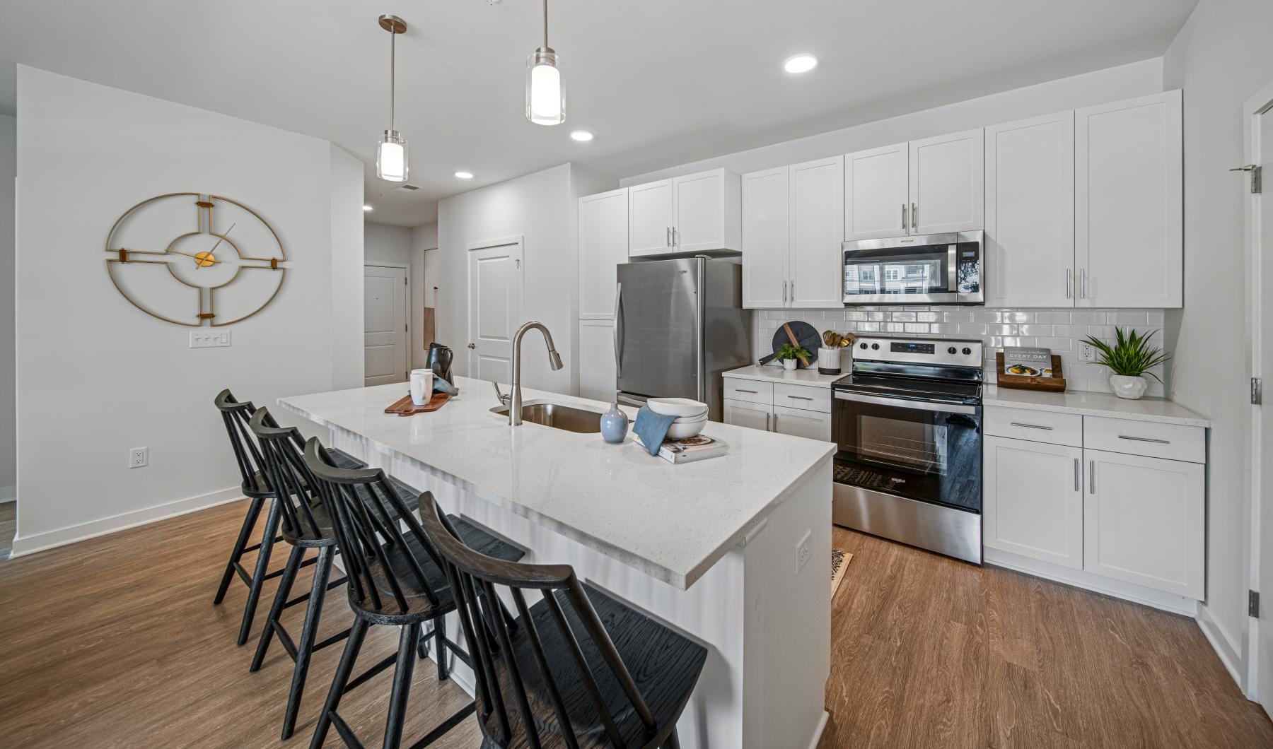 a kitchen with white cabinets